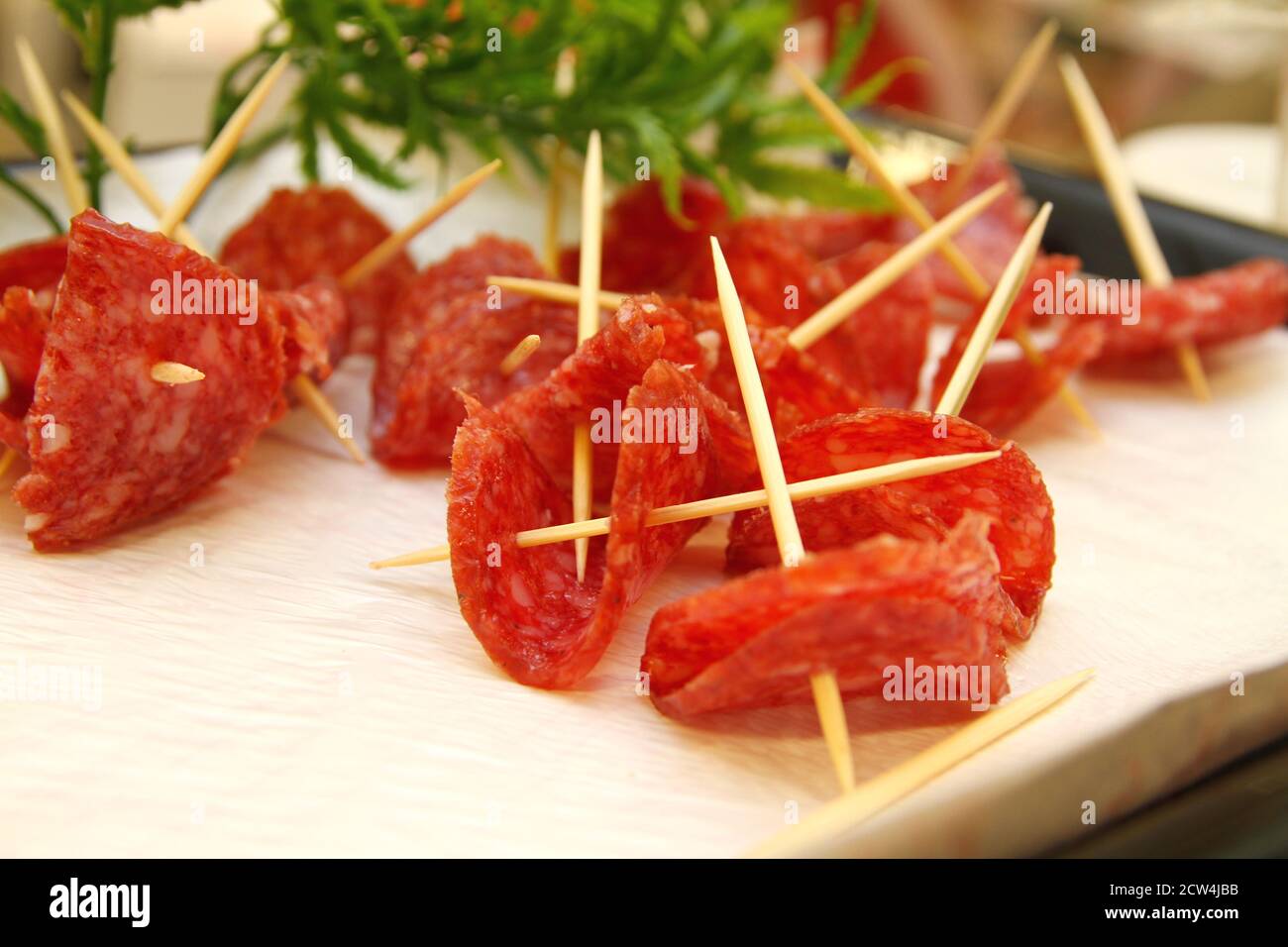 appetizers salami in toothpick Stock Photo Alamy