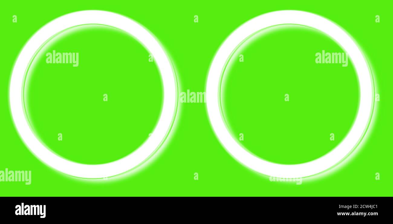 two white round frames on a green background for paintings Stock Photo