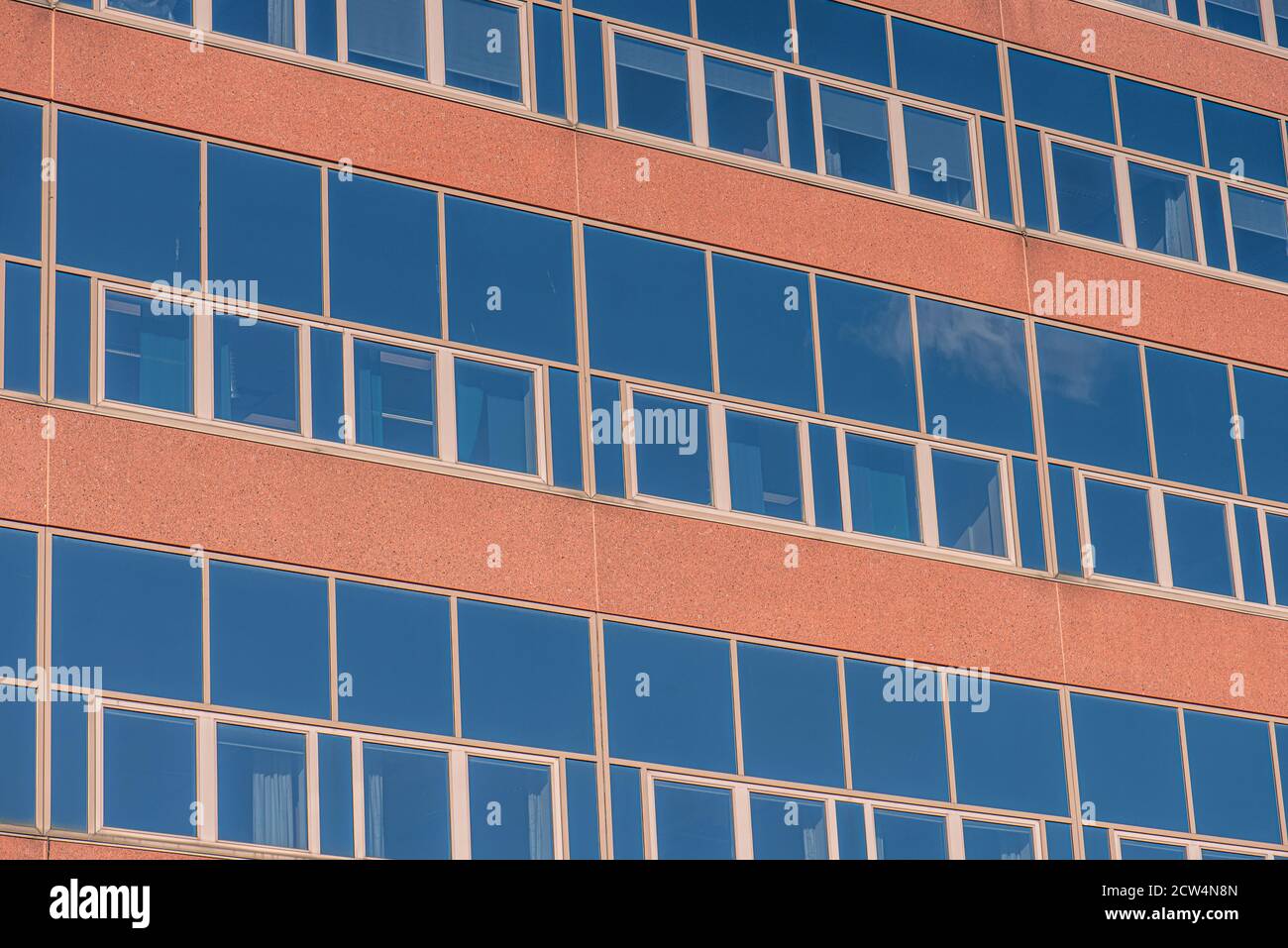 Glass facade of an abandoned office complex Stock Photo