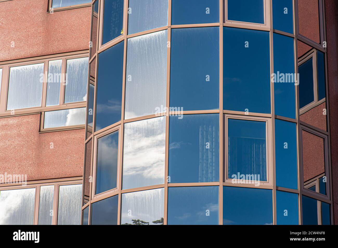 Glass facade of an abandoned office complex Stock Photo - Alamy