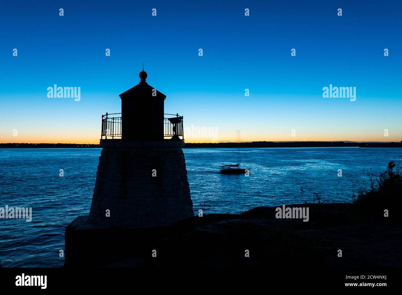 Boat passing Castle Hill Lighthouse, Newport, Rhode Island, USA. Stock Photo