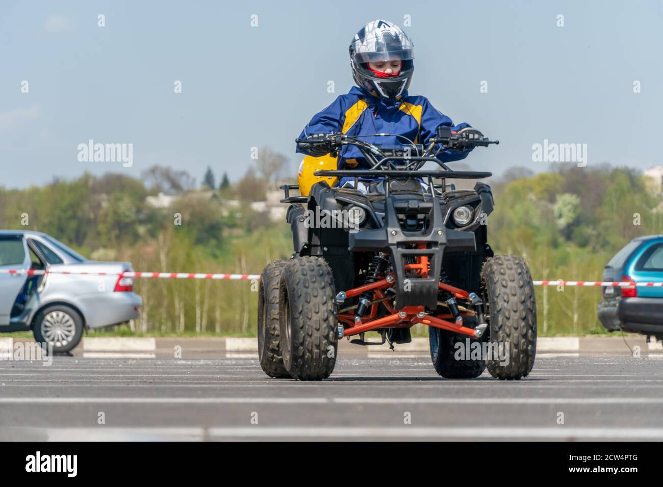 Extreme acrobatics on a Quad bike. A teenage child performs tricks on a