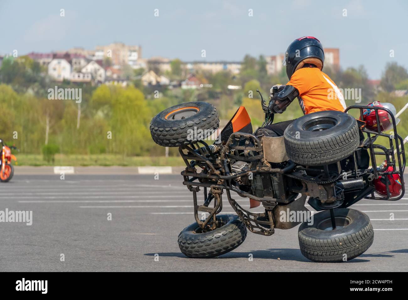 Extreme acrobatics on a Quad bike. A teenage child performs tricks on a