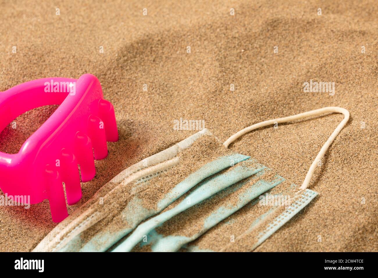 fuchsia little boy toy rake with Waste during COVID-19. Discarded to ...