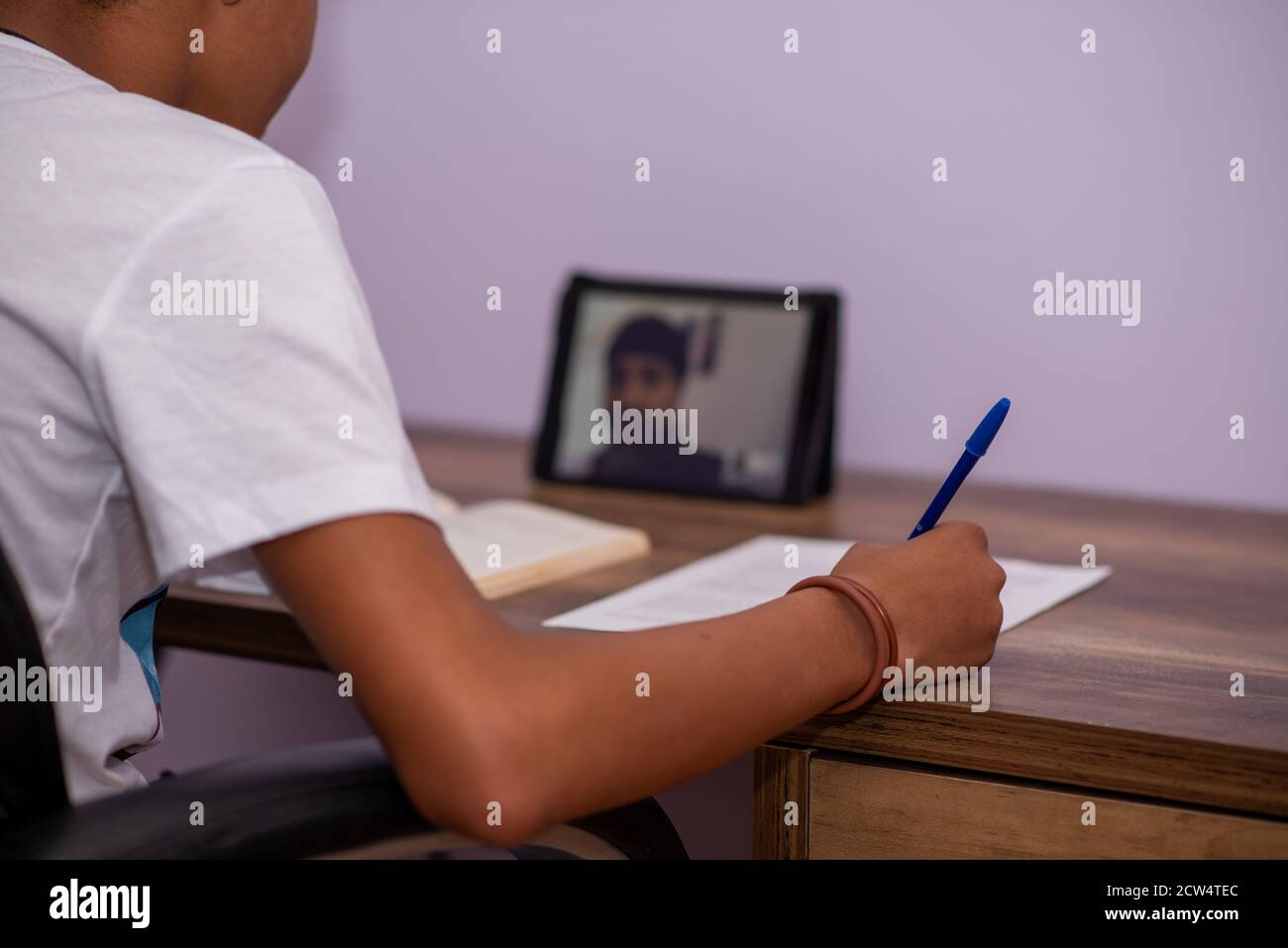 Young boy having a virtual teaching session Stock Photo - Alamy