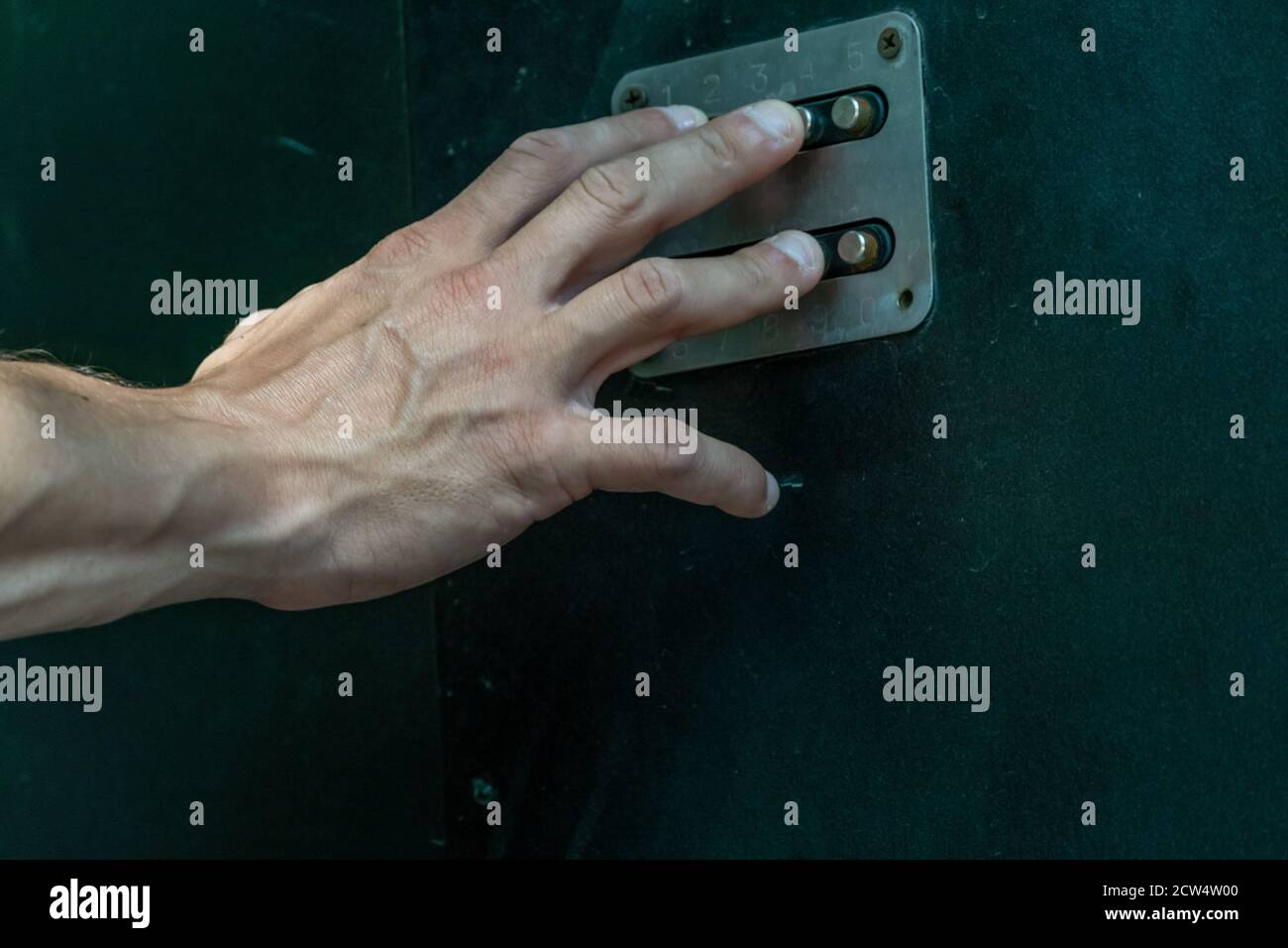 man's hand dials the code from the door intercom close up Stock Photo ...