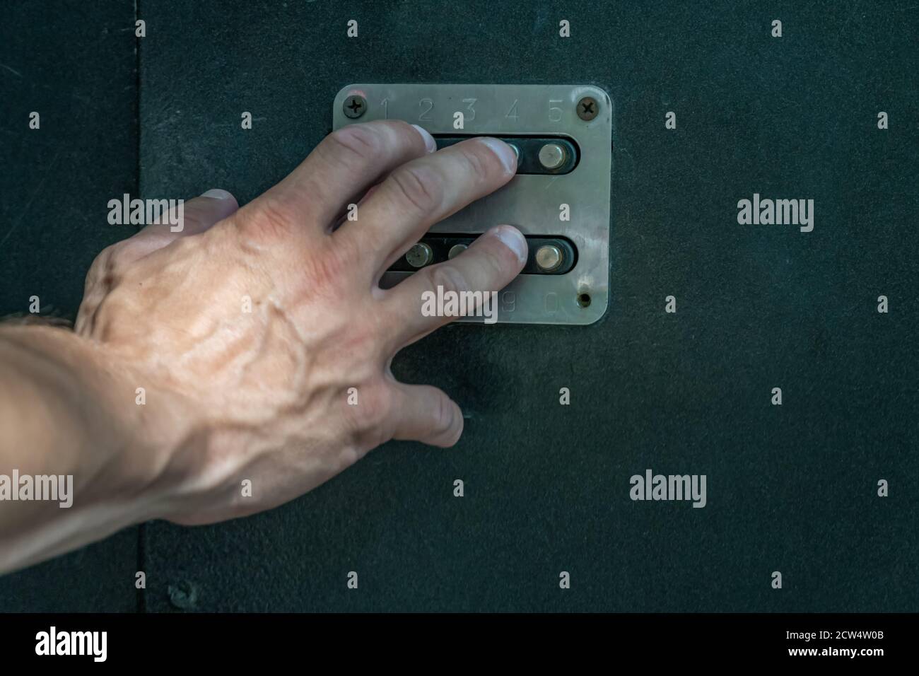 man's hand dials the code from the door intercom close up Stock Photo ...