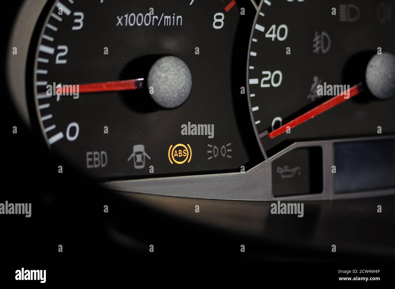 The ABS sensor lights up orange in the car dashboard Stock Photo Alamy