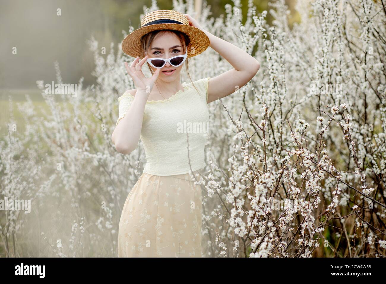 Spring Girl Spring fashion girl outdoor portrait in bloom . Beauty Romantic woman ...