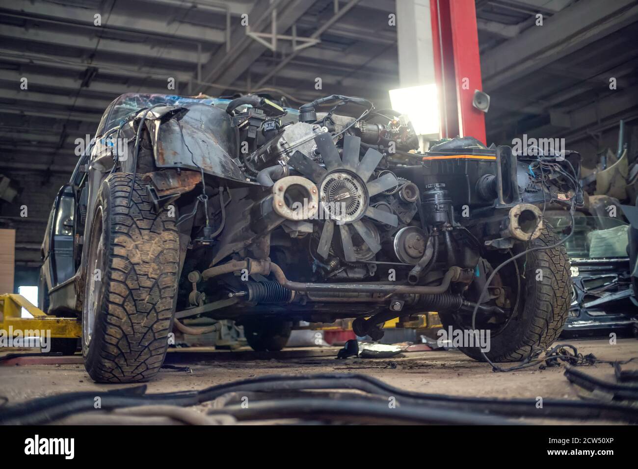 Semidisassembled car after an accident closeup on the auto Assembly