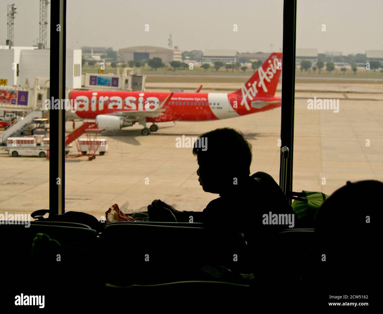 Passengers, airplanes and services at the terminal of Yangon international airport, Myanmar,SE Asia Stock Photo
