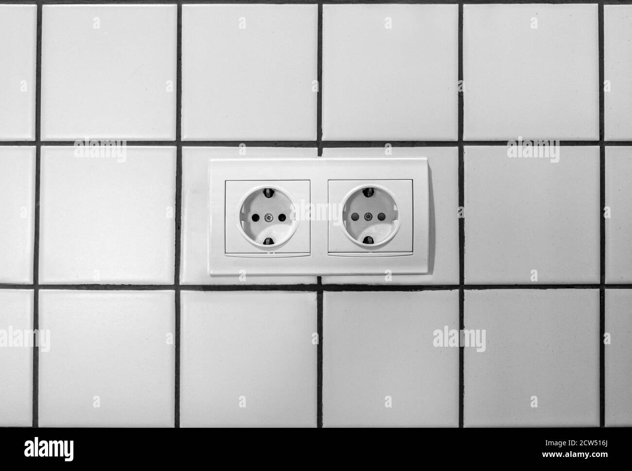 white double electrical outlet mounted on white wall Stock Photo Alamy