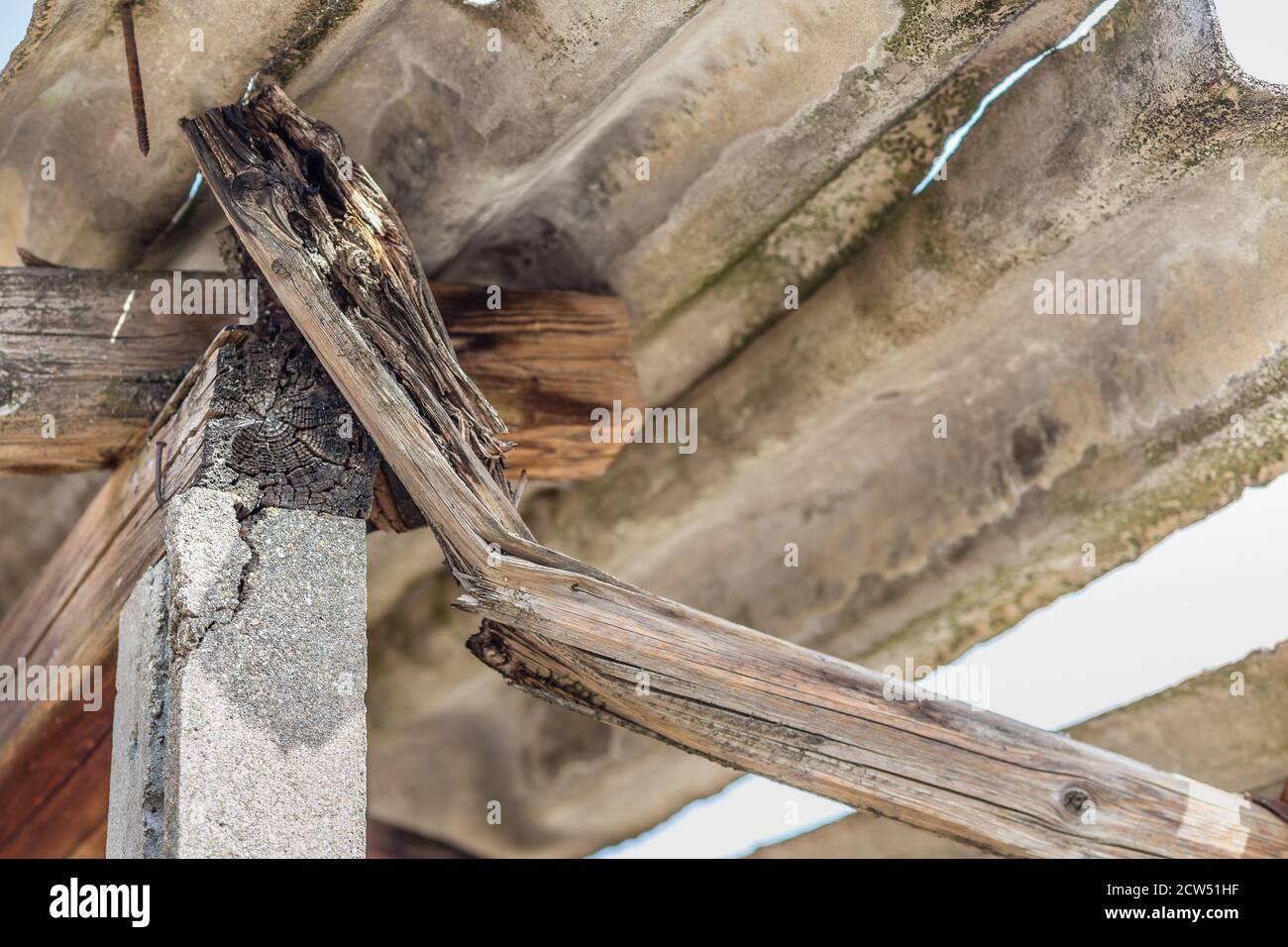 damaged wooden beam under roofing in dangerous fibre cement Stock Photo Alamy