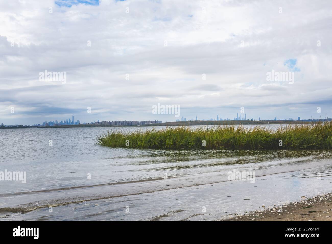 bay with sand and grass at Jamaica bay wildlife refuge with nyc background Stock Photo