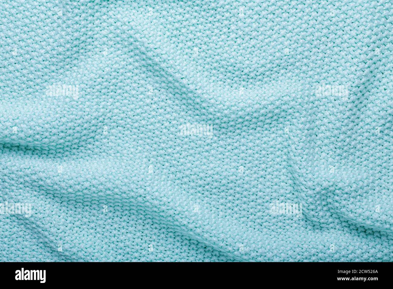 Mint knitting wool texture background Crocheted fabric texture Stock Photo