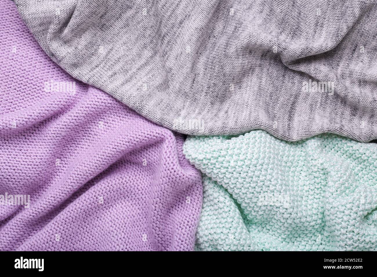 Gray, mint and lilac knitting wool texture background Crocheted fabric texture Stock Photo