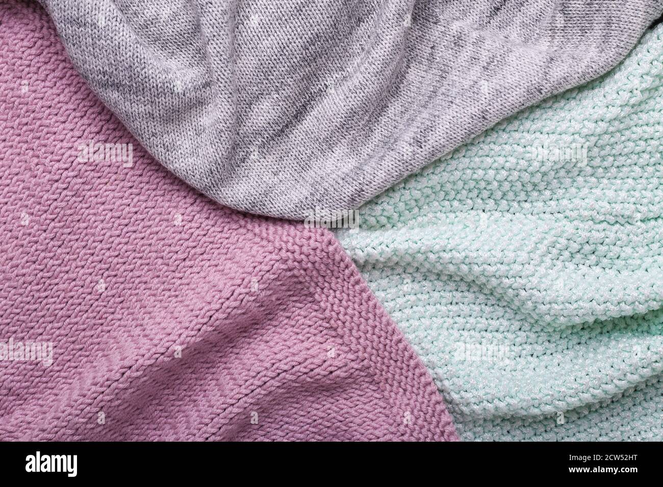 Gray, mint and lilac knitting wool texture background Crocheted fabric texture Stock Photo