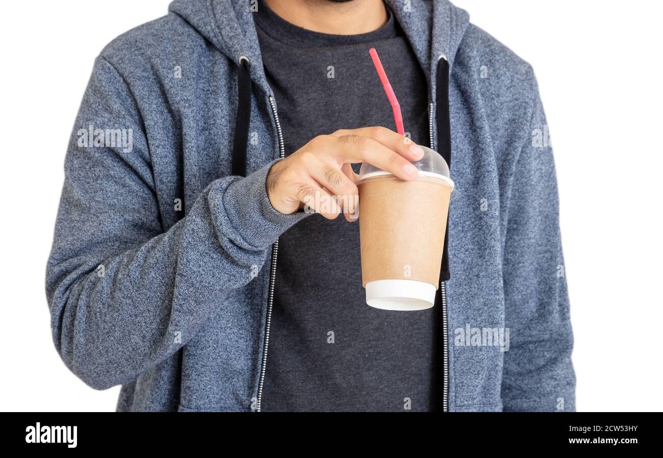 Man with coffee. Body of young person wearing blue hooded sweatshirt with zip drinks fresh beverage from paper container with straw isolated on white Stock Photo