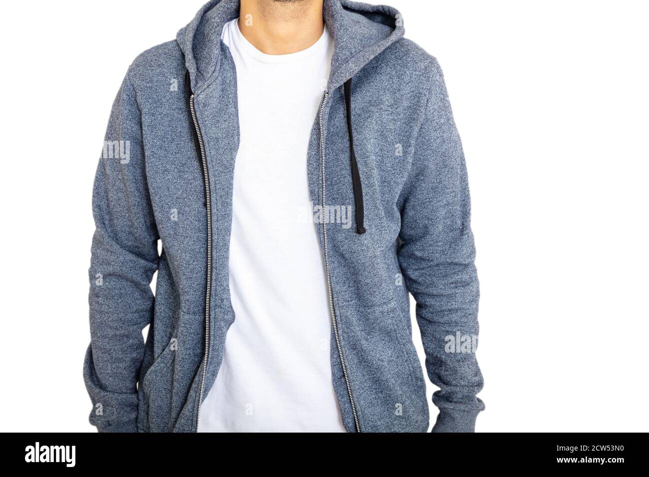 Body of adult young man standing wearing blue hooded sweatshirt with zip isolated on white background. Cool, brunette person with casual style. Front Stock Photo