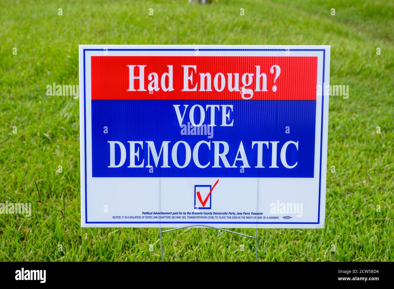 Stafford Texas - September 27, 2020: HAD ENOUGH? VOTE DEMOCRATIC election signs are seen in many residential areas in Texas Stock Photo