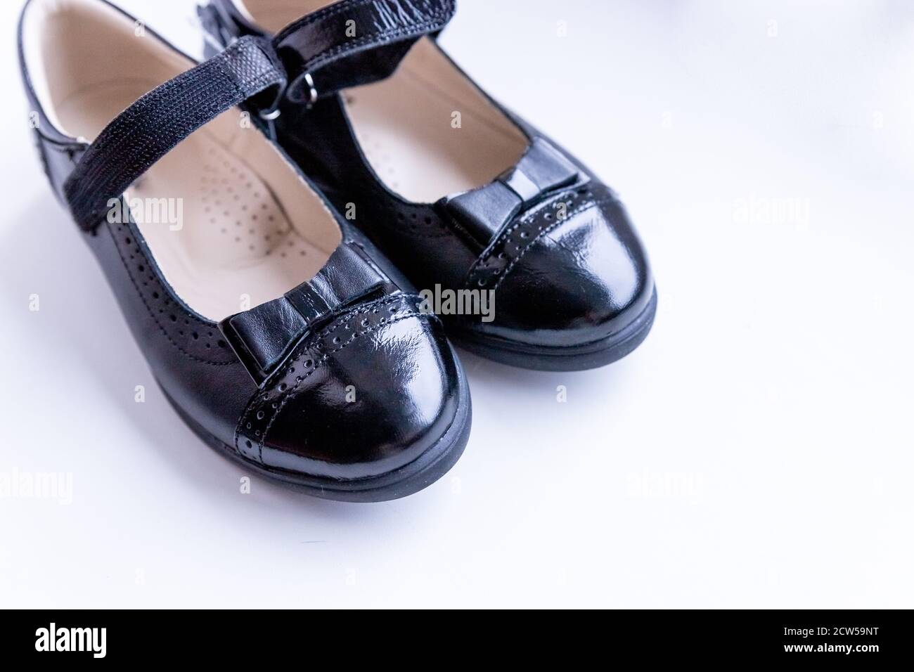 Enumerate Bare Transport Fashionable black stylish girl's leather loafers on white background. Fashionable  school shoes.Elegant kid's shoes Stock Photo - Alamy