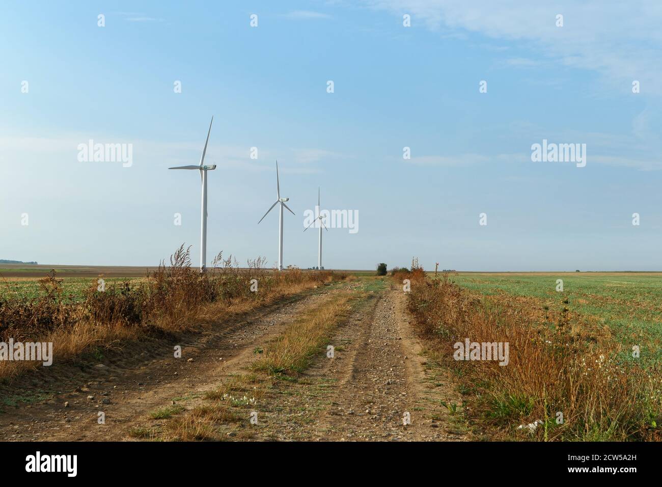 Saclas, France. September 20. 2020. Structure that works with the wind to generate electricity. Wind turbine lined up in a field. Renewable energy. Stock Photo