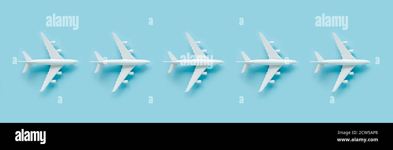 White model plane, airplane on blue background. Top view, flat lay.  Stock Photo