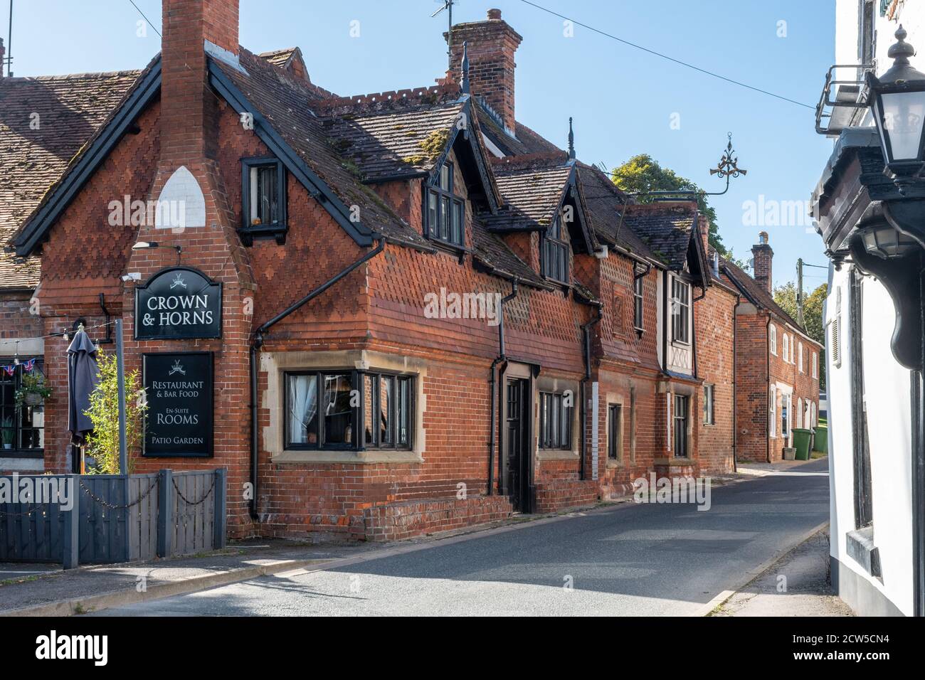 The historic Crown and Horns pub in the pretty village of East Ilsley, Berkshire, England, UK Stock Photo