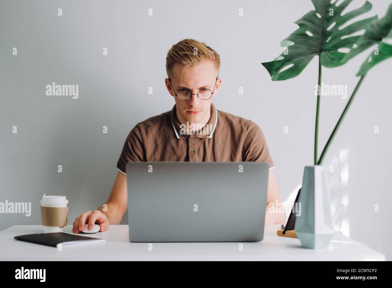 Focused software developer writing code hi-res stock photography and ...