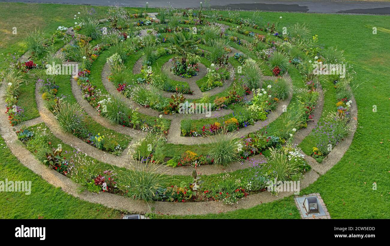 Flower bed in concentric circles in a lawn, high angle view, found alont the old city walls of Boulogne sur mer, Oise, France Stock Photo