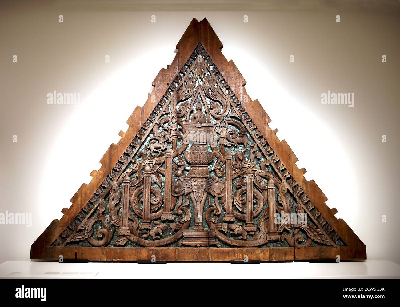 Temple front pediment. Wood with glass inlays. 18th century. Suphan Buri, Thailand. Thai art. Museum of World Cultures, Barcelona, Spain. Stock Photo