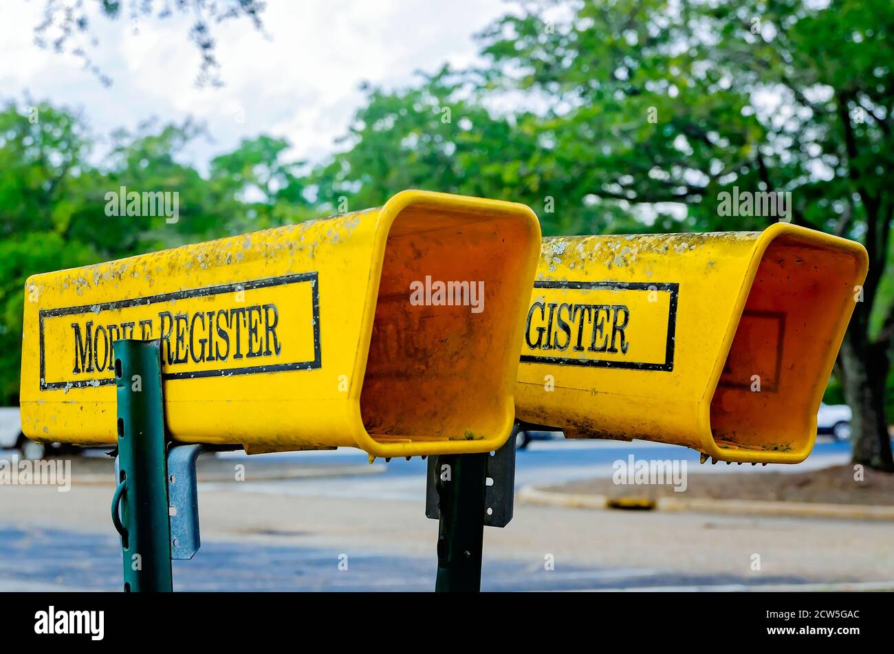 Newspaper holders offer receptacles for mail delivery of the Mobile Register, a local daily newspaper, Sept. 26, 2020, in Mobile, Alabama. Stock Photo