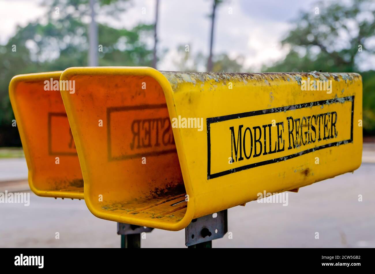 Newspaper holders offer receptacles for mail delivery of the Mobile Register, a local daily newspaper, Sept. 26, 2020, in Mobile, Alabama. Stock Photo