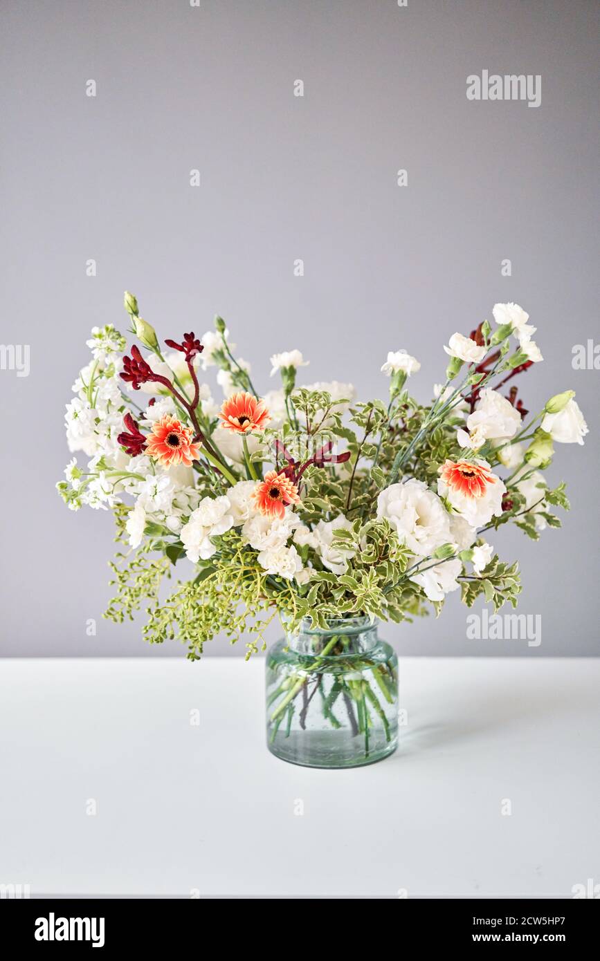 Bouquet 003. Sekective focus on flowers. Series, step by step installation of flowers in a vase. Flowers bunch, set for home. Delivery fresh cut Stock Photo