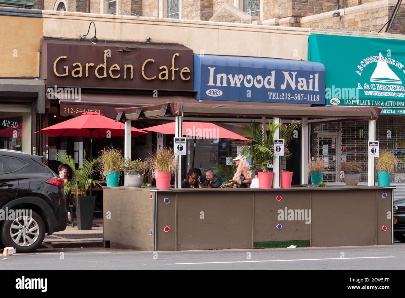 a dining booth in the street set up by the Garden Cafe restaurant in Inwood to comply with covid-19 or coronavirus regulations in nyc Stock Photo