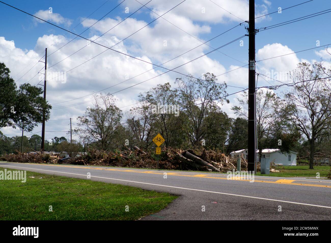 Debris gathered at the edge of U.S. 98 following the destruction of Hurricane Sally east of Foley, Alabama. Stock Photo