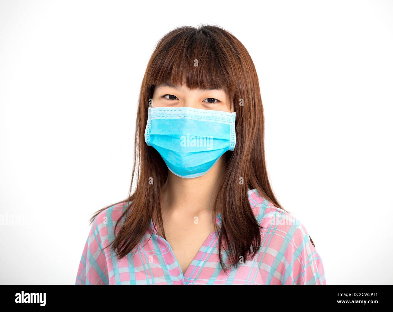 Close up   Asian teenager girl wearing medical mask Stock Photo