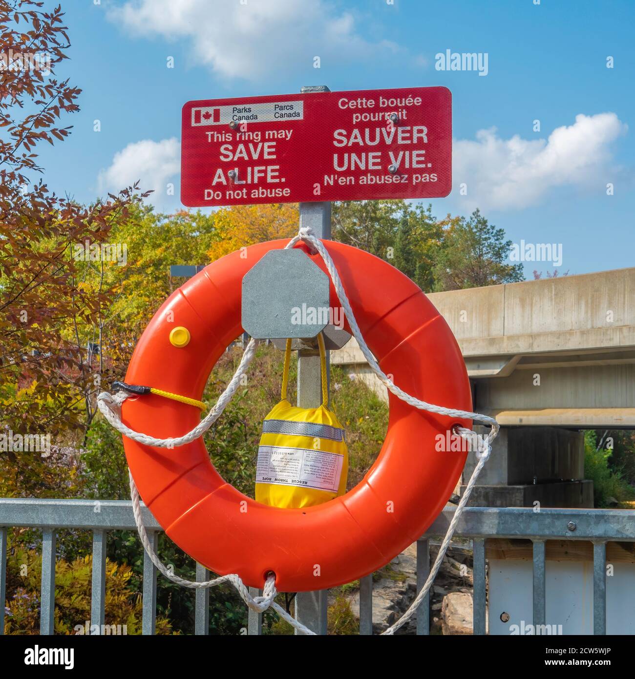 Lifesaving equipment available near a dam and waterfall in Haliburton County Ontario. Stock Photo