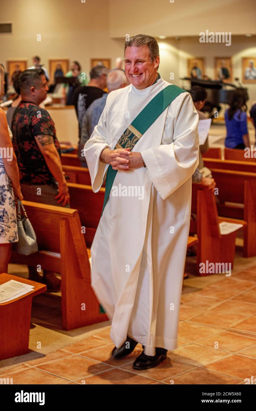 The deacon of a Southern California Catholic church marches up the
