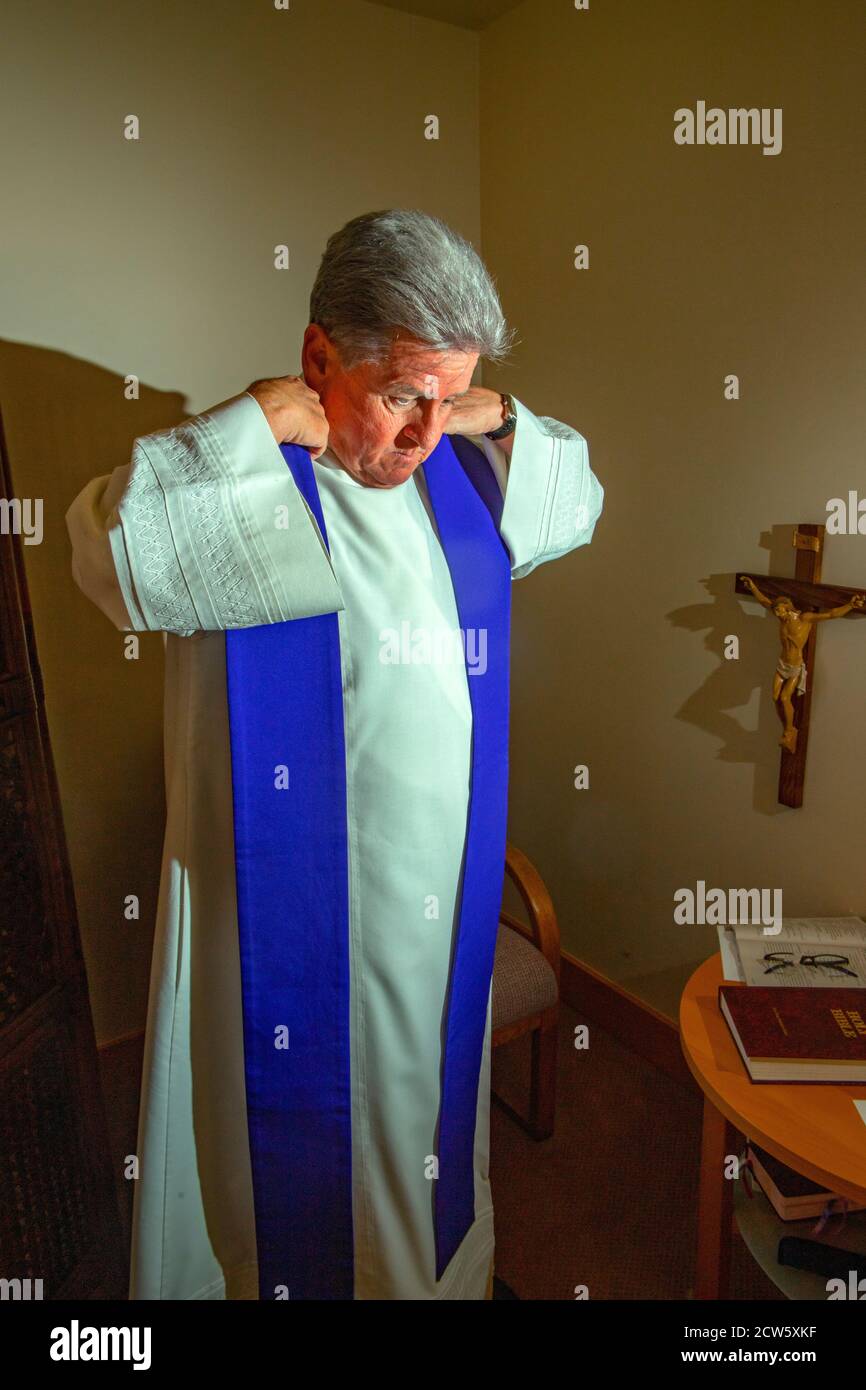 Wearing ceremonial vestments, the monsignor of a Southern California
