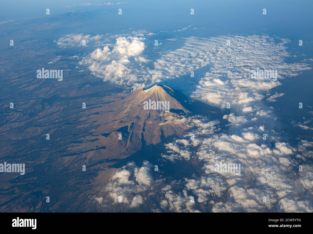 A scenic aerial view of Popocatepetl, a second highest peak in Mexico. It is an active stratovolcano, located in the states of Puebla, Morelos and Mex Stock Photo