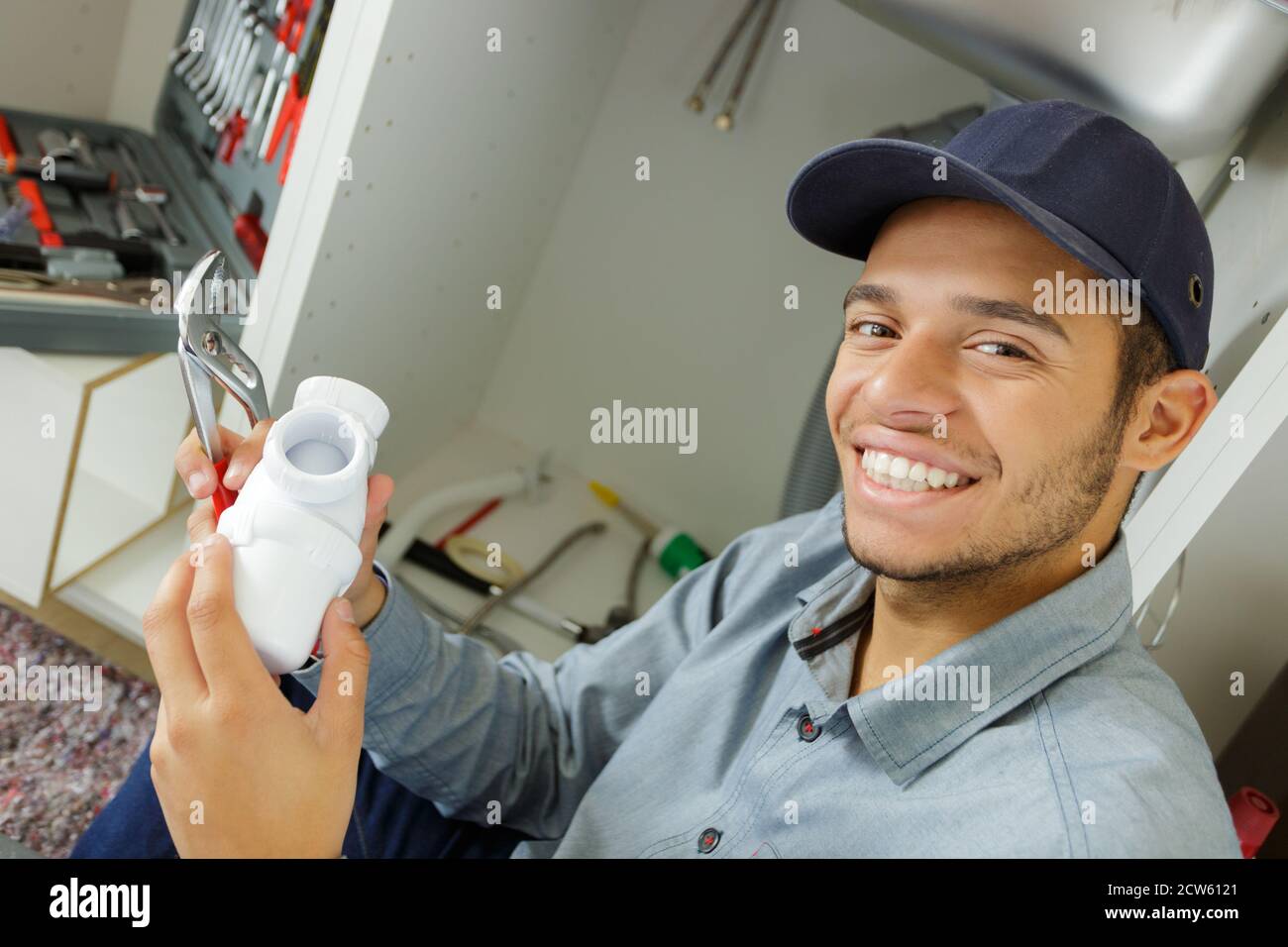 Happy male worker demonstrating hi-res stock photography and images - Alamy