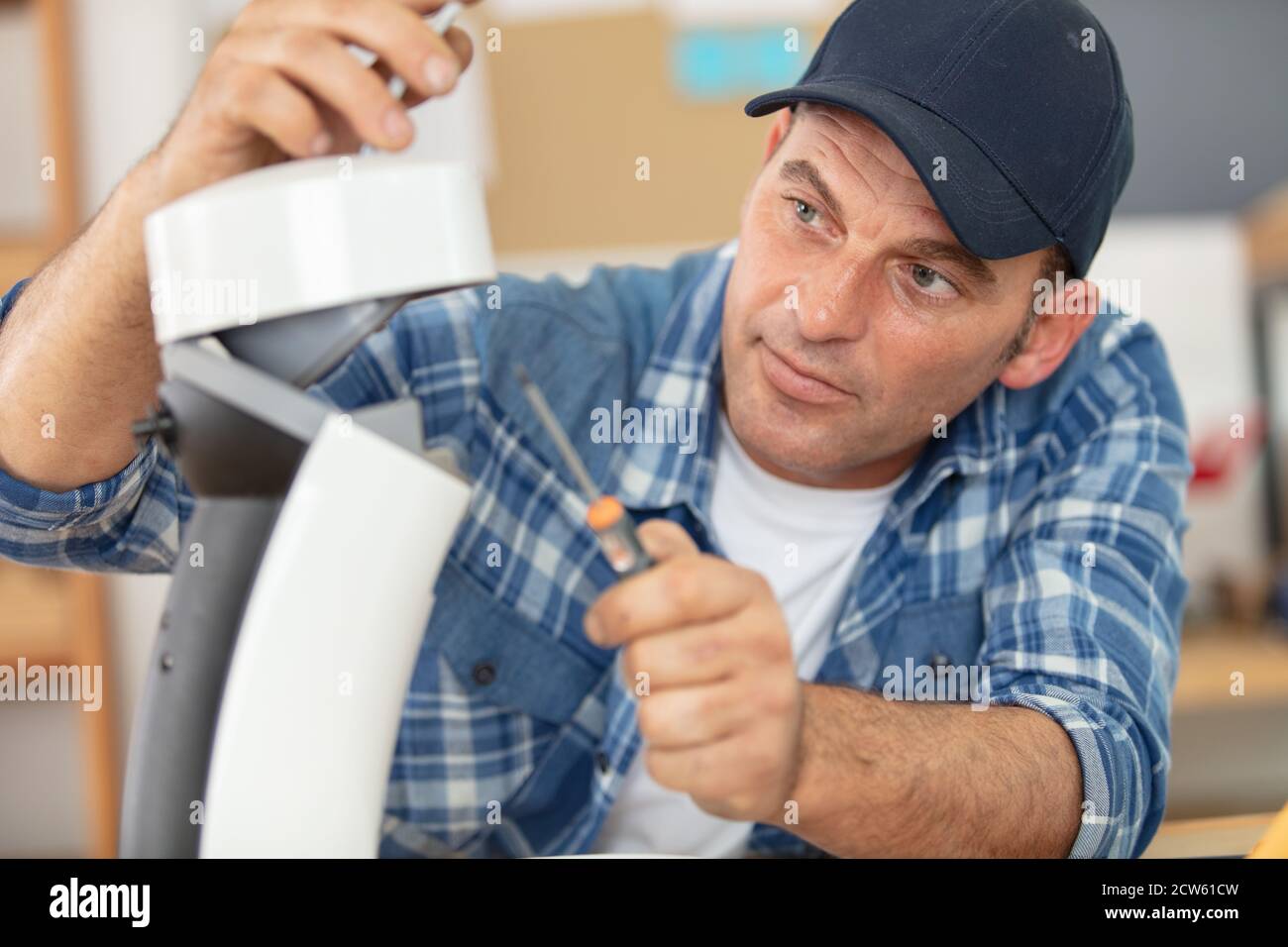 male technician repairing a coffee machine Stock Photo Alamy