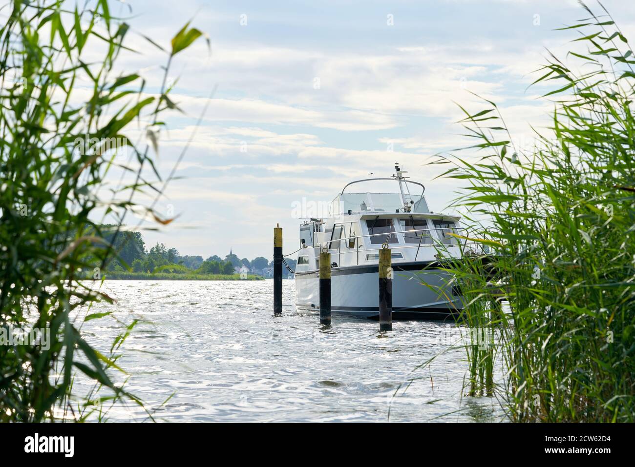 Yacht at a pier on the river Havel near Toeplitz in Germany Stock Photo