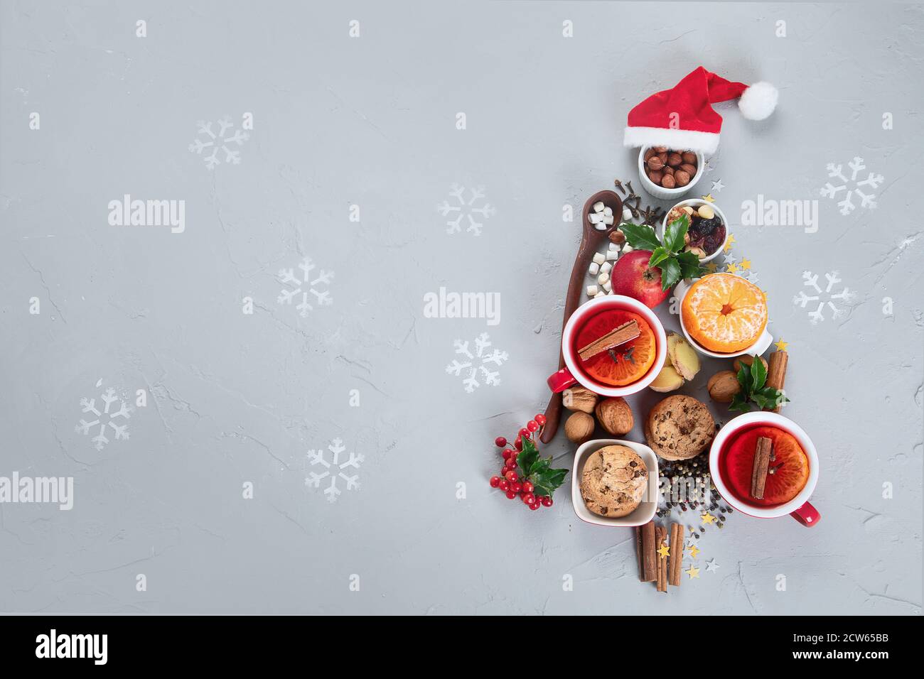 Christmas Tree made of holiday food on concrete background. Top view, flat lay  with copy space. Christmas concept. New Year Holidays background. Stock Photo