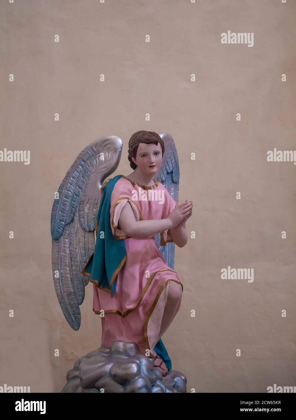 Colourful Angel statue in Mexico Roman Catholic church with copy space Stock Photo