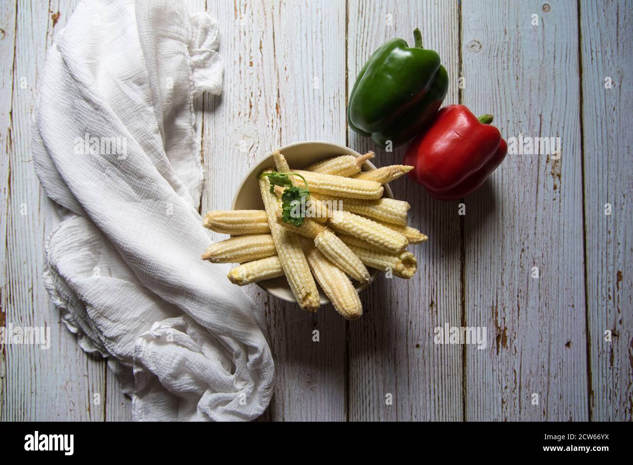 Top view of baby corns and bell peppers on a background Stock Photo