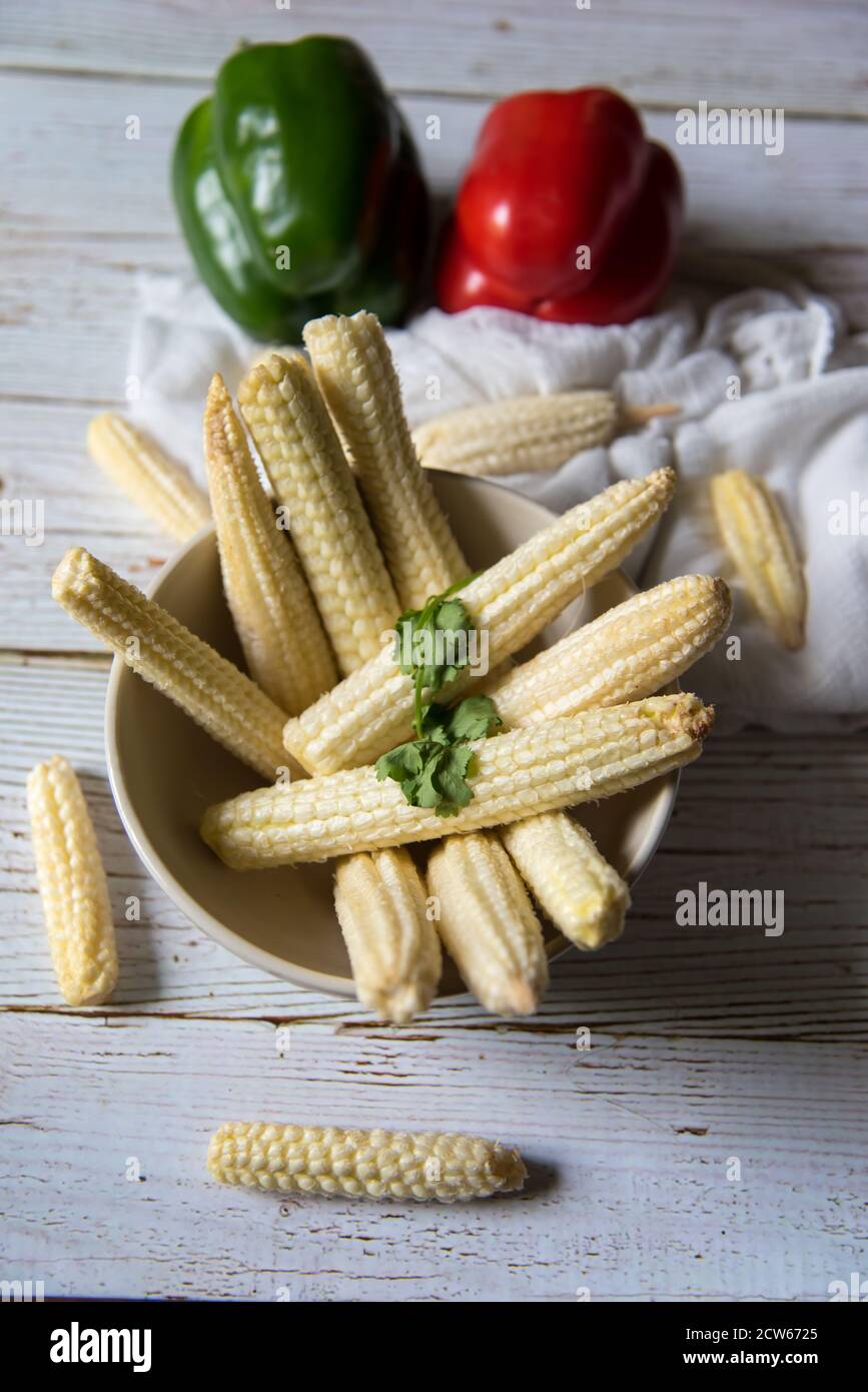 Raw fresh baby corns in a bowl Stock Photo