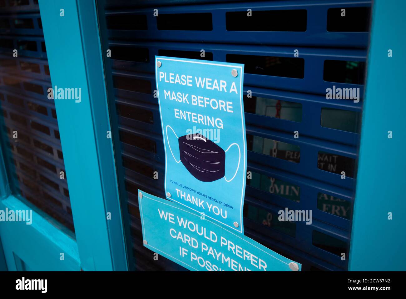 COVID 19 health and safety wear mask sign for shoppers in retail store