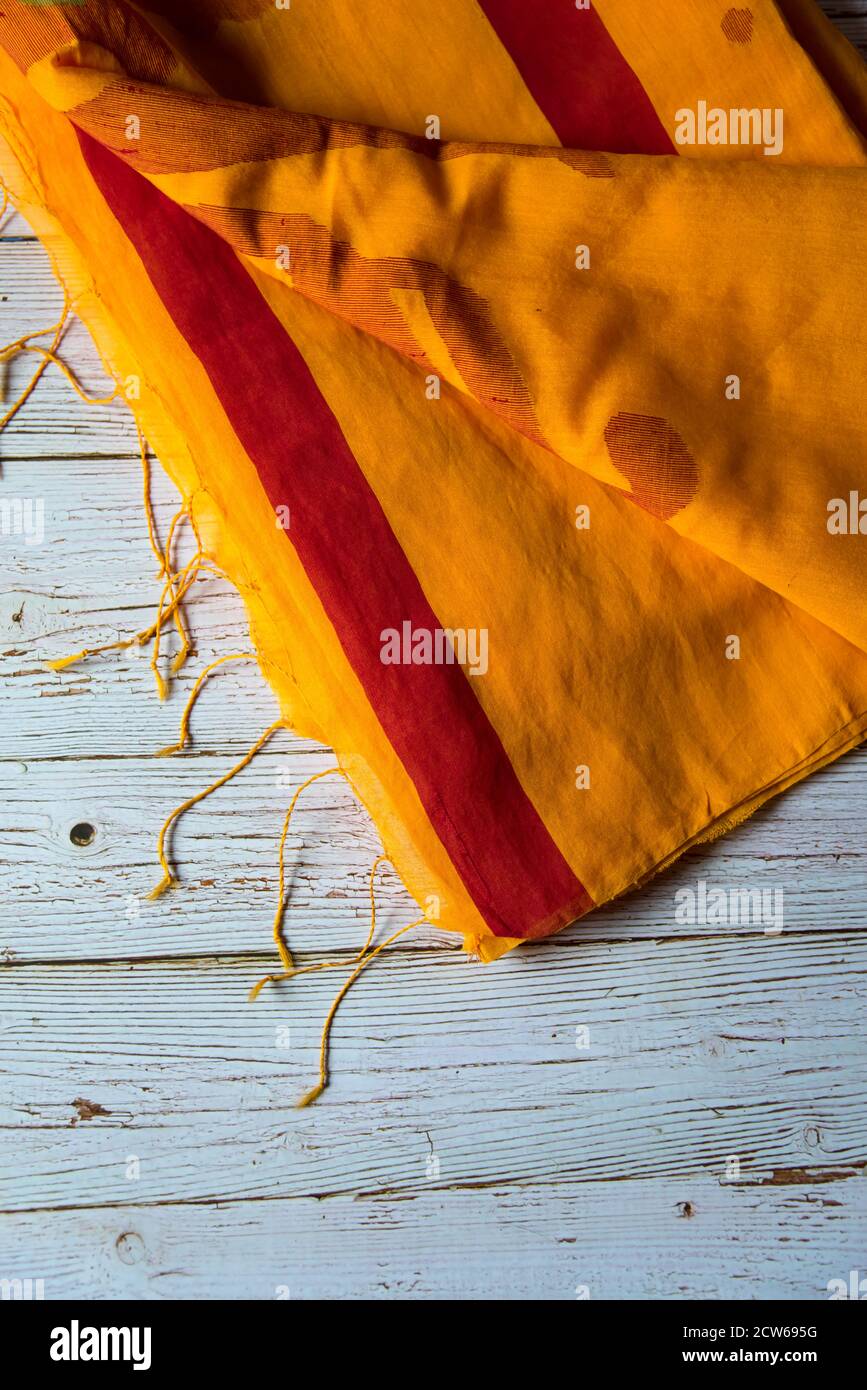 Yellow cotton sari on a background Stock Photo